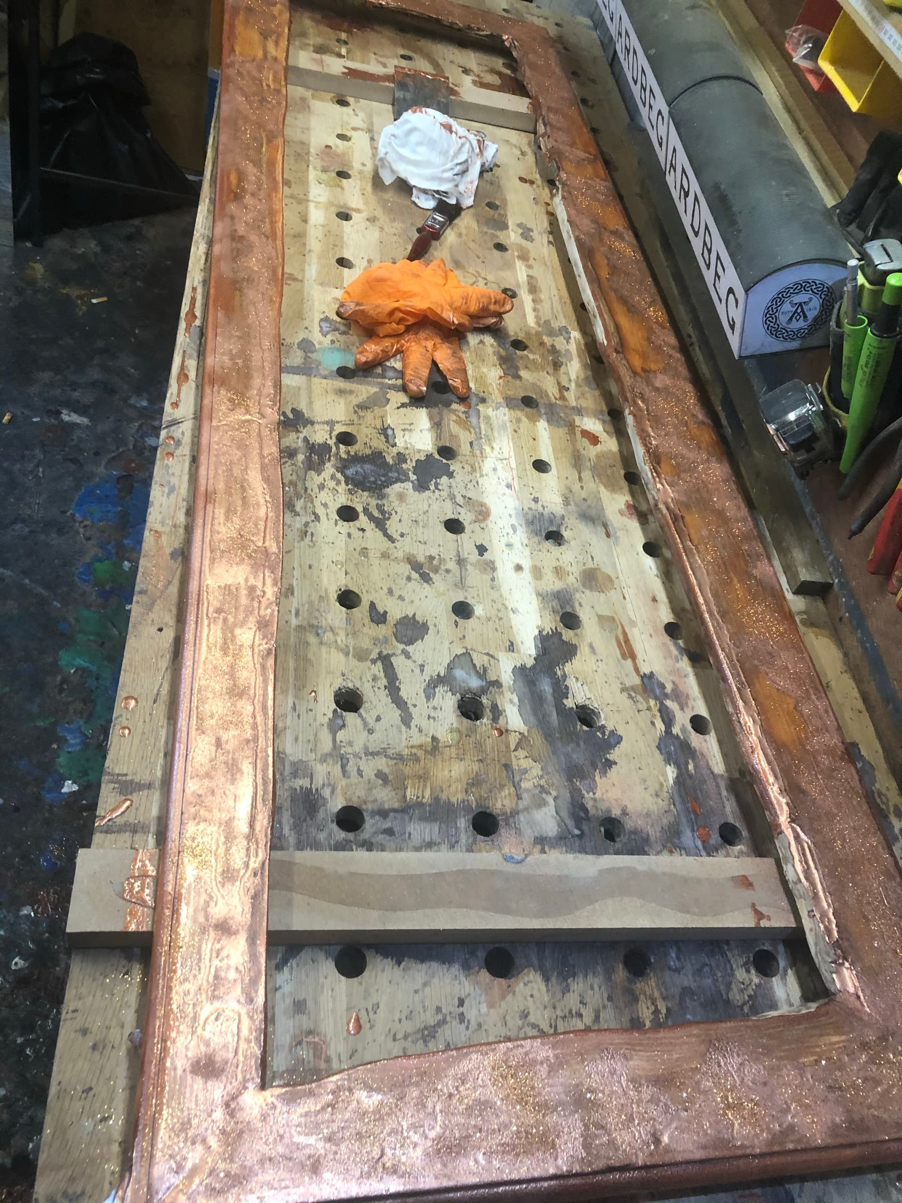 The frame laid flat mid-construction on the workbench, before assembly