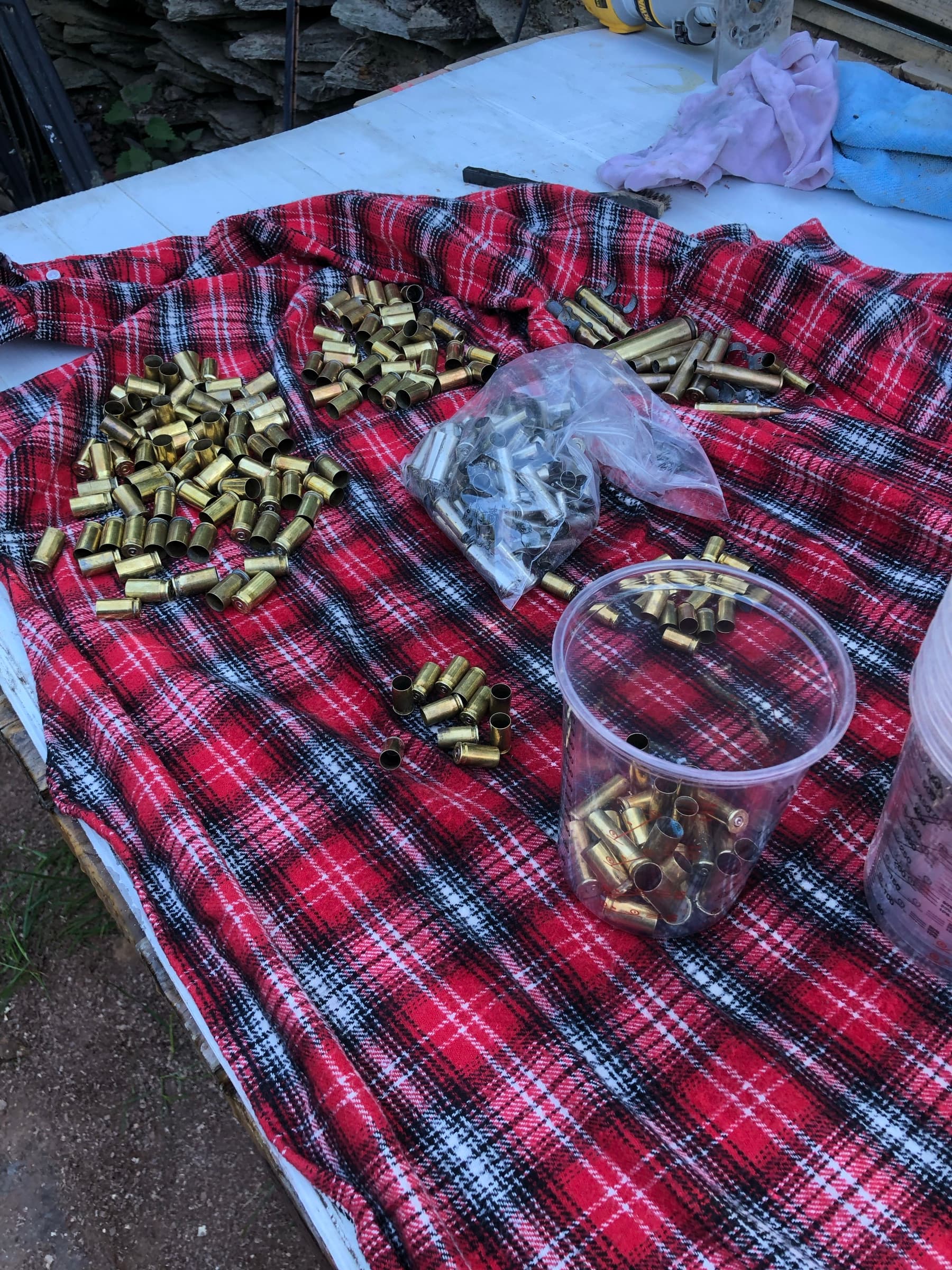 Brass cartridge casings sorted and counted before being set into the resin river