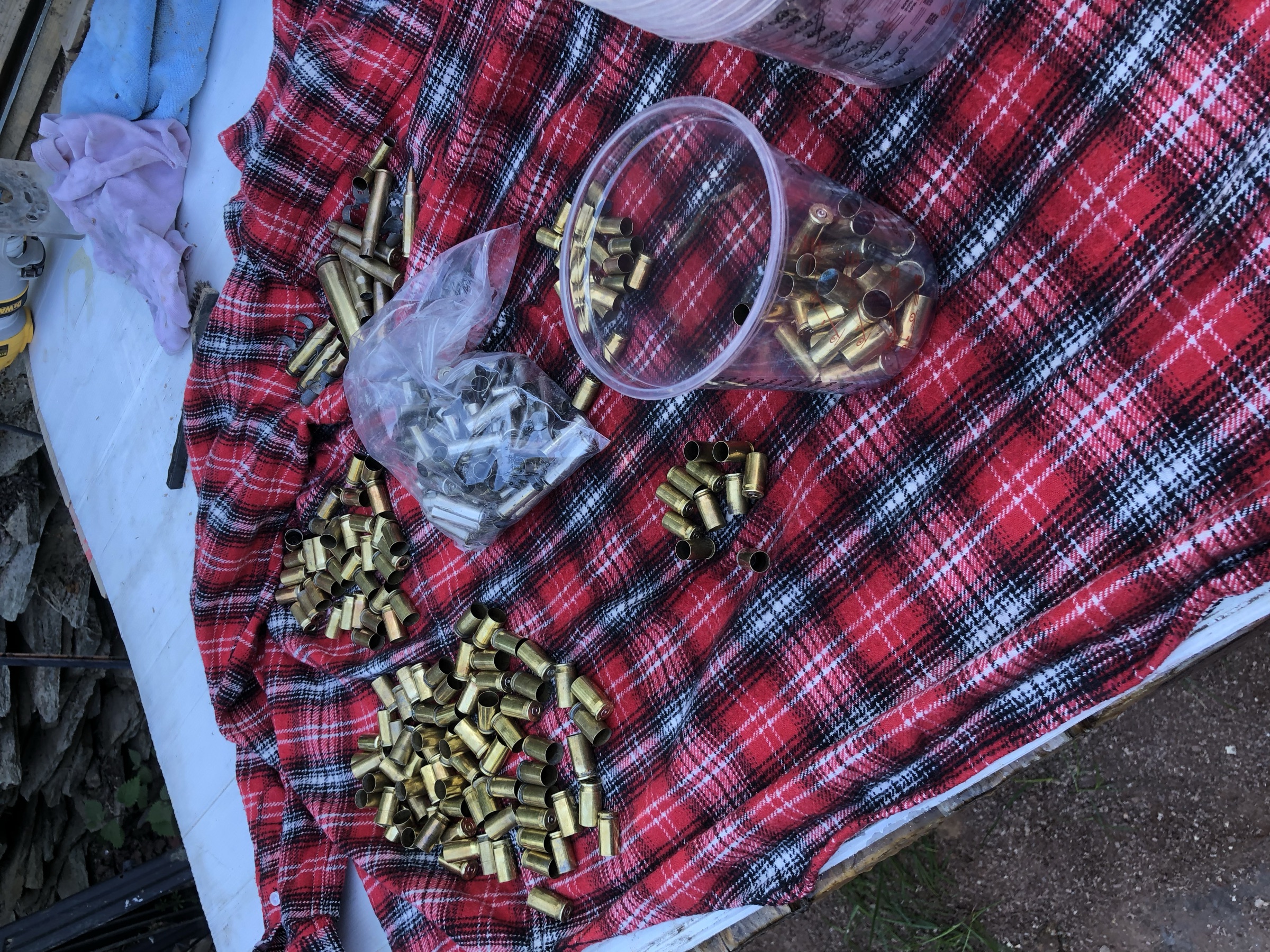 Brass cartridge casings sorted and counted before being set into the resin river